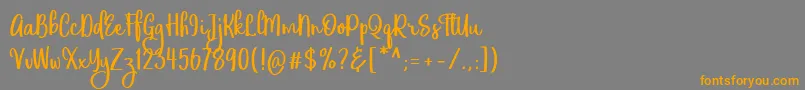 フォントEufoniemTwo – オレンジの文字は灰色の背景にあります。