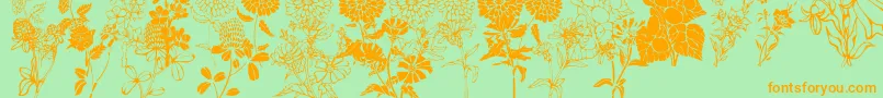 DtFlowers1-Schriftart – Orangefarbene Schriften auf grünem Hintergrund