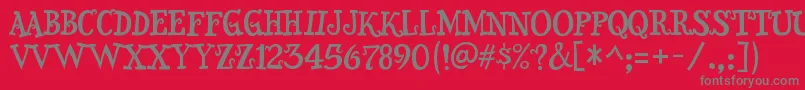 フォントSnidelyRegular – 赤い背景に灰色の文字