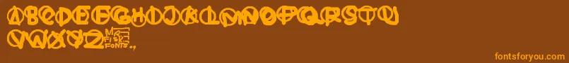 フォントHardware – オレンジ色の文字が茶色の背景にあります。