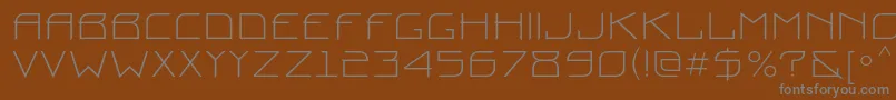 Prounc-fontti – harmaat kirjasimet ruskealla taustalla