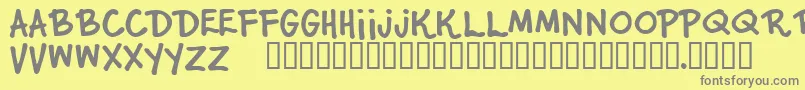 フォントJuniorStar – 黄色の背景に灰色の文字