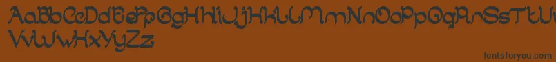 フォントArabianKnight – 黒い文字が茶色の背景にあります