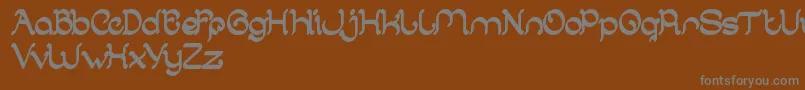 ArabianKnight-fontti – harmaat kirjasimet ruskealla taustalla