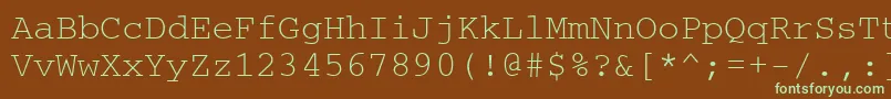 フォントCouriercyrillic – 緑色の文字が茶色の背景にあります。