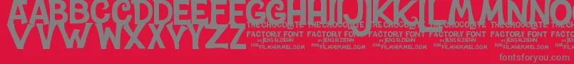 フォントCharlieTheChocolateFactory – 赤い背景に灰色の文字