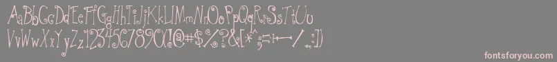 フォントGreywolfQuirk – 灰色の背景にピンクのフォント