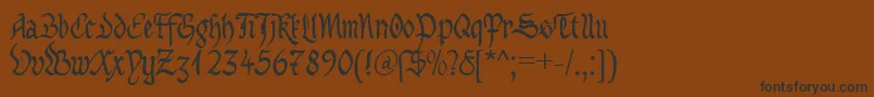 フォントMaBastardAnglicanaDb – 黒い文字が茶色の背景にあります