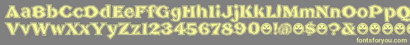 BrokenPosterTour Font – Yellow Fonts on Gray Background