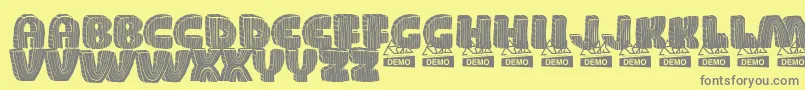 WoodDemo-Schriftart – Graue Schriften auf gelbem Hintergrund