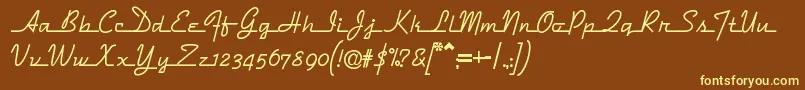 フォントDymaxionscript – 黄色のフォント、茶色の背景