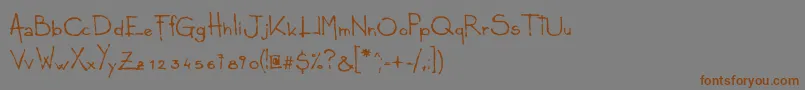 フォントLudico – 茶色の文字が灰色の背景にあります。