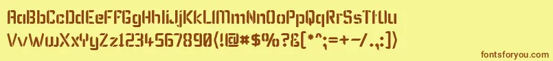 KarismaStencil-Schriftart – Braune Schriften auf gelbem Hintergrund
