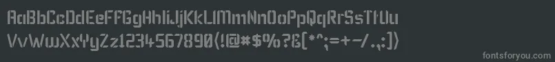 フォントKarismaStencil – 黒い背景に灰色の文字