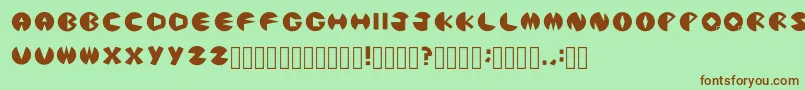 PacmanicRegular-fontti – ruskeat fontit vihreällä taustalla