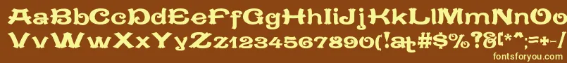 CaracteredoubletLimitedVersion-fontti – keltaiset fontit ruskealla taustalla