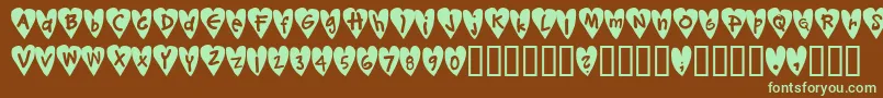 Czcionka Djellibejbi – zielone czcionki na brązowym tle