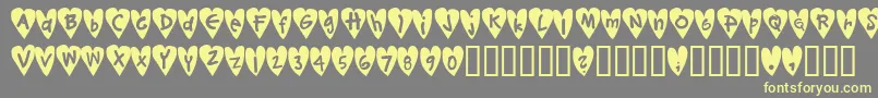 Djellibejbi-Schriftart – Gelbe Schriften auf grauem Hintergrund