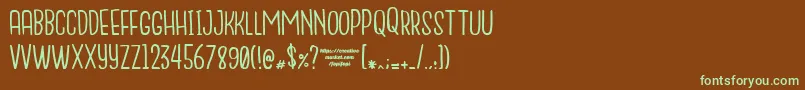 フォントNanda – 緑色の文字が茶色の背景にあります。