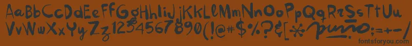 Kokekoko Font – Black Fonts on Brown Background