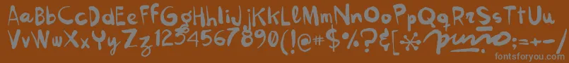 Kokekoko Font – Gray Fonts on Brown Background