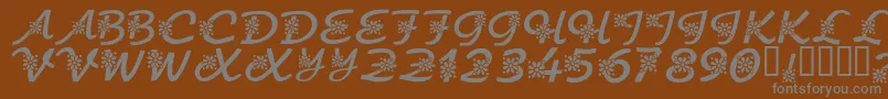 KrFloralScript-Schriftart – Graue Schriften auf braunem Hintergrund