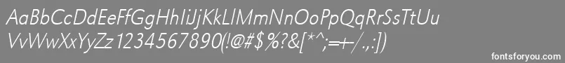 UrwgrotesktextligextnarOblique-Schriftart – Weiße Schriften auf grauem Hintergrund