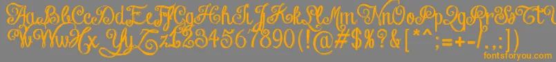フォントChalkHandLetteringShaded – オレンジの文字は灰色の背景にあります。