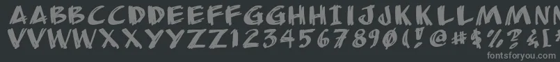 Anudrg-fontti – harmaat kirjasimet mustalla taustalla