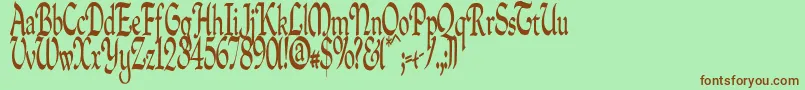 フォントQuillpc – 緑の背景に茶色のフォント