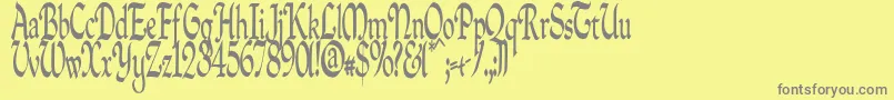 Quillpc-fontti – harmaat kirjasimet keltaisella taustalla