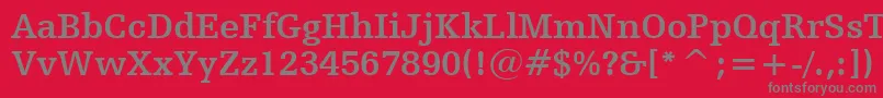 HumanistSlabserif712BoldBt-fontti – harmaat kirjasimet punaisella taustalla