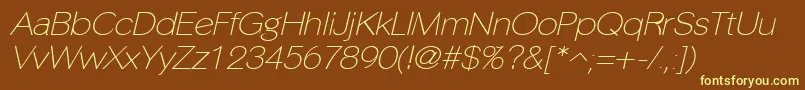 PhinsterfineItalic-fontti – keltaiset fontit ruskealla taustalla