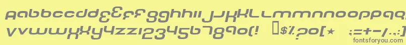 フォントTechFontWideItalic – 黄色の背景に灰色の文字