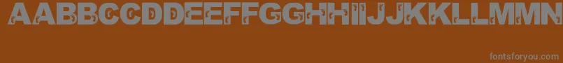 JennasFeet Font – Gray Fonts on Brown Background