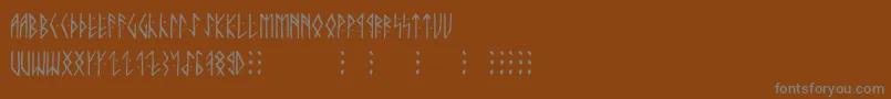 Runicaltno Font – Gray Fonts on Brown Background