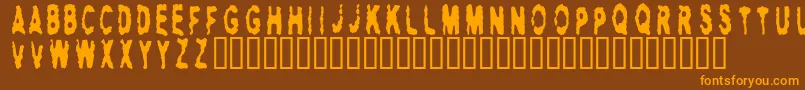 フォントHitman ffy – オレンジ色の文字が茶色の背景にあります。