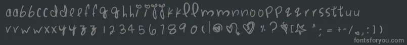 フォントPunchdrunklove – 黒い背景に灰色の文字