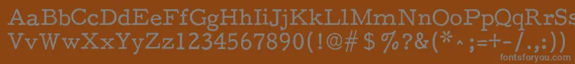 フォントF25Executive – 茶色の背景に灰色の文字