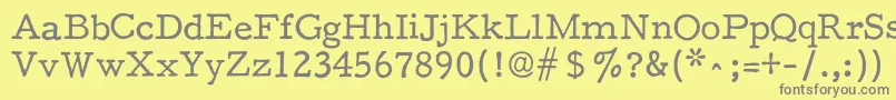 フォントF25Executive – 黄色の背景に灰色の文字