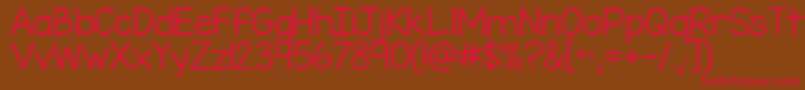 Kgmisskindergarten-fontti – punaiset fontit ruskealla taustalla