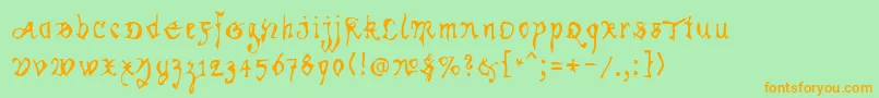 フォントKracklite – オレンジの文字が緑の背景にあります。