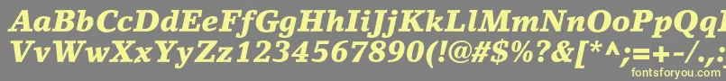 フォントLinoletterstdBlackit – 黄色のフォント、灰色の背景