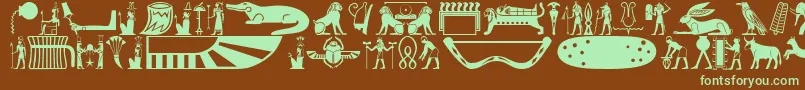 フォントOldegyptglyphs – 緑色の文字が茶色の背景にあります。