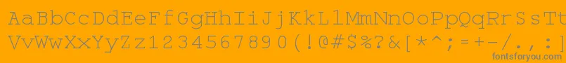 Monospace-fontti – harmaat kirjasimet oranssilla taustalla