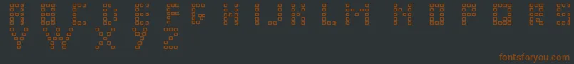 Fonte Pixelchunker – fontes marrons em um fundo preto