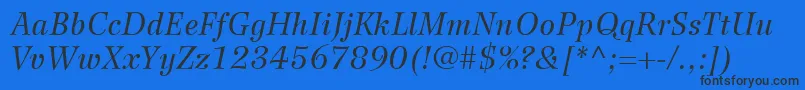 WilkeLt56Italic Font – Black Fonts on Blue Background