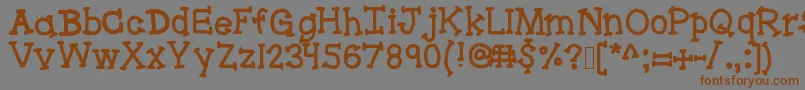 フォントBracketeer – 茶色の文字が灰色の背景にあります。