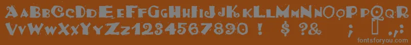 Tacosrg-fontti – harmaat kirjasimet ruskealla taustalla