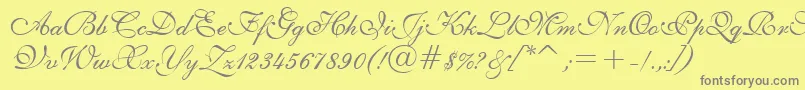 E111psto-fontti – harmaat kirjasimet keltaisella taustalla